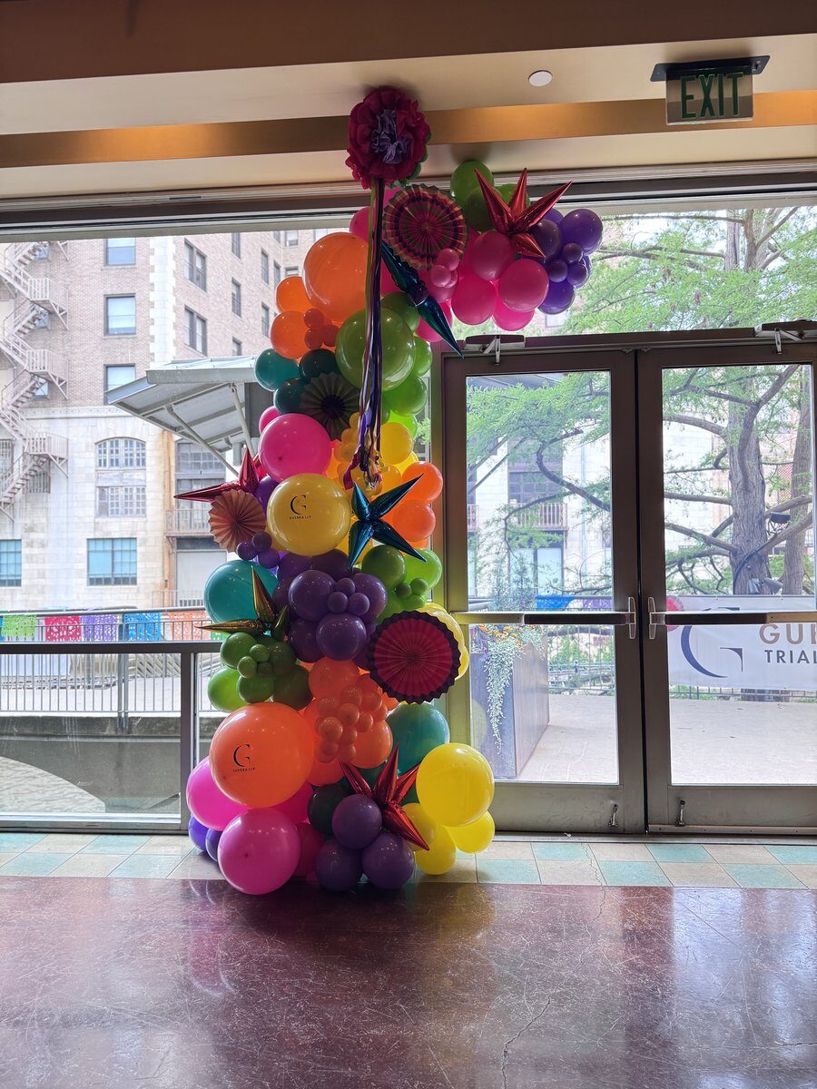 Balloon arch in fiesta colors for Guerra Group Fiesta San Antonio TX
