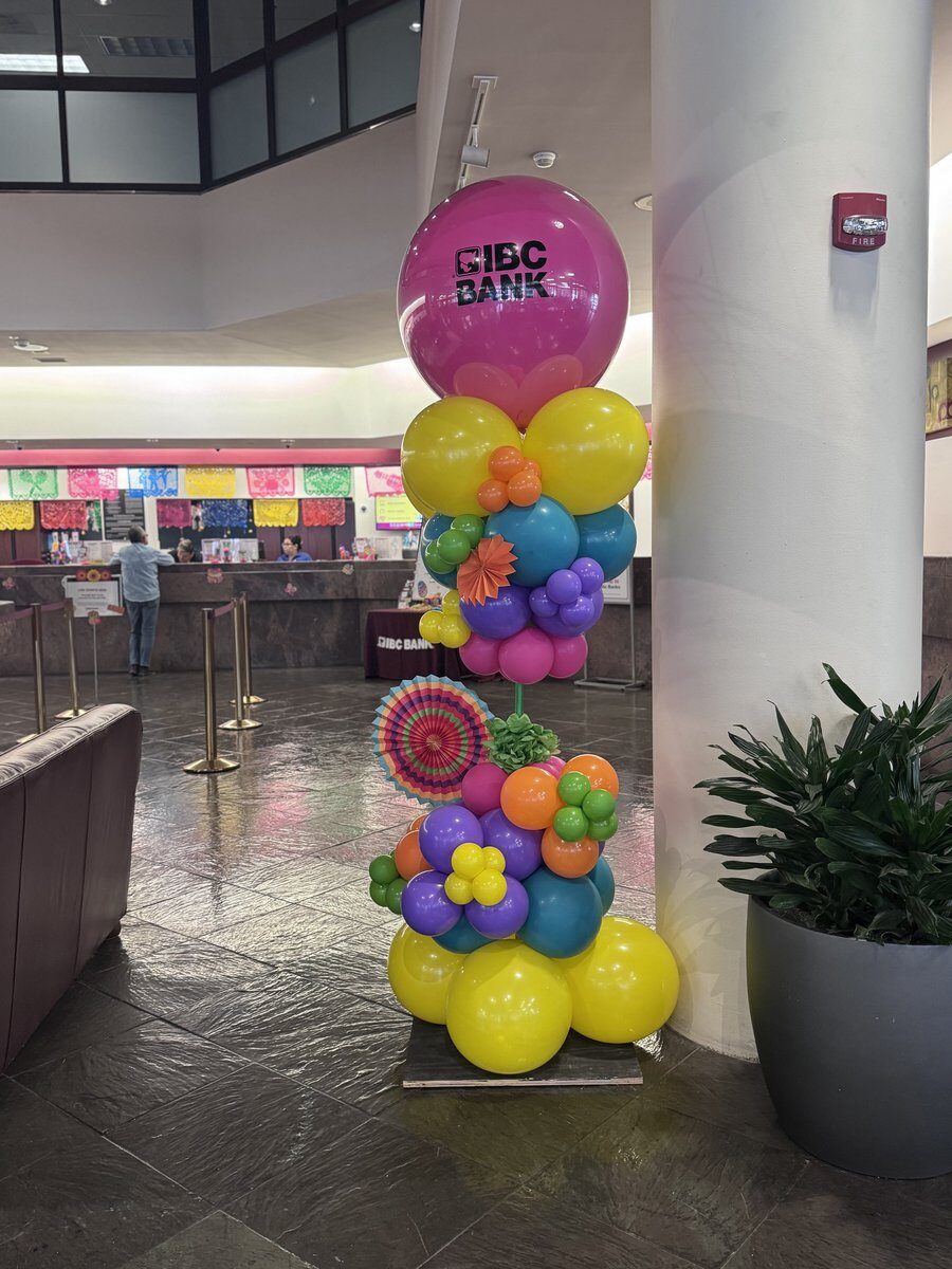 Custom balloon garland installation for IBC Bank Fiesta event in San Antonio TX